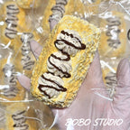 Creamy Chocolate Drizzle Eclair Taba Squishy Fidget Toy