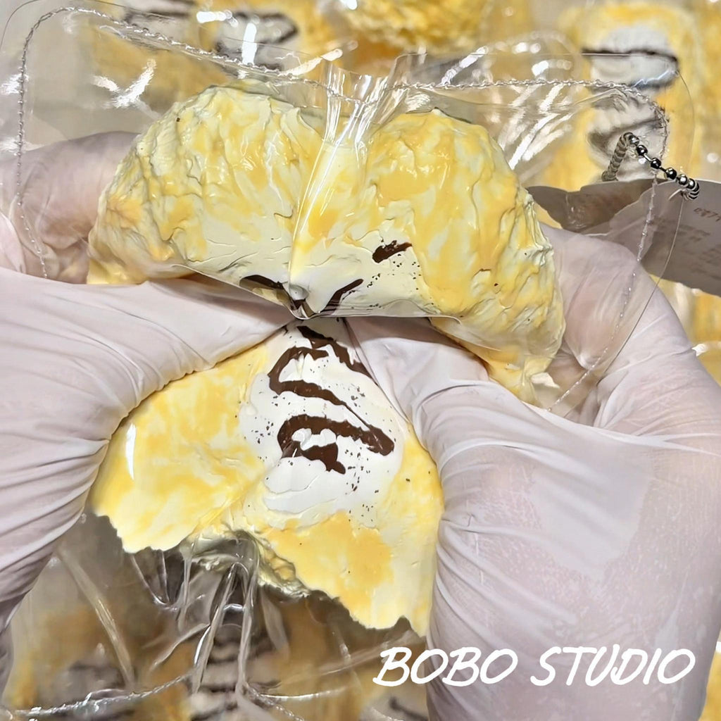 Creamy Chocolate Drizzle Eclair Taba Squishy Fidget Toy